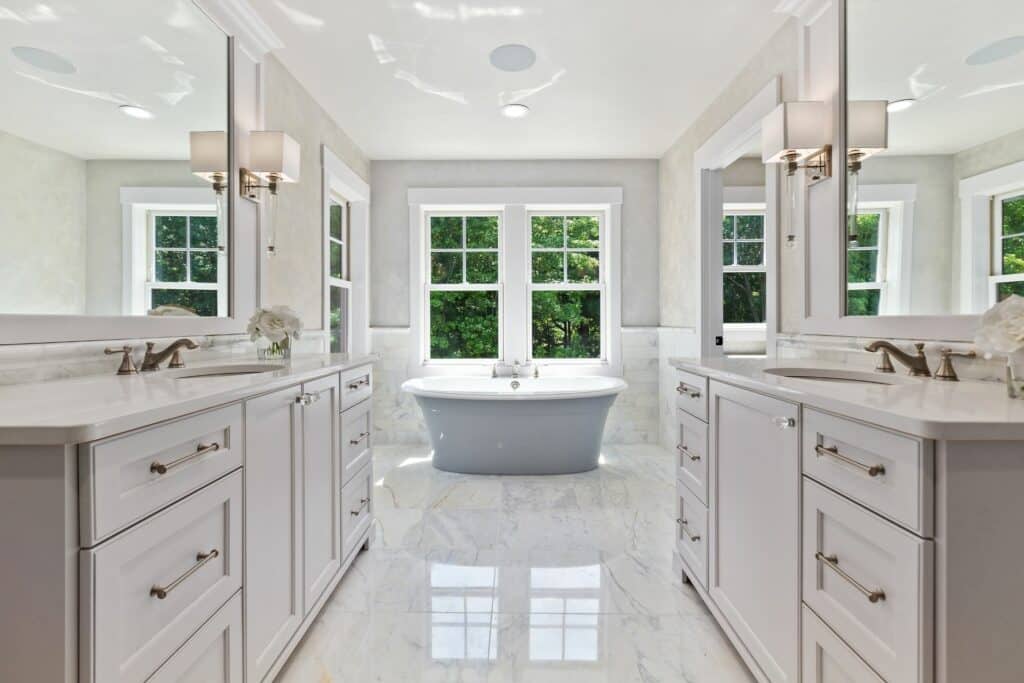 Grey bathroom cabinets with bathtub