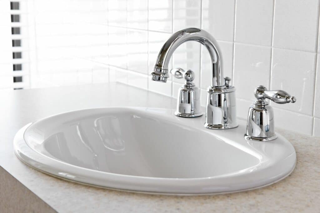 copper faucet white sink