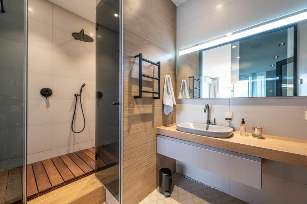 modern bathroom remodel with sink, toilet and bathtub